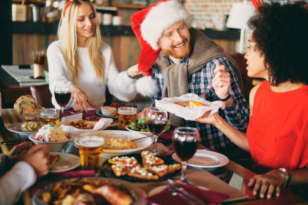 istock Friends having dinner at home at Christmas eve. 1051988940
