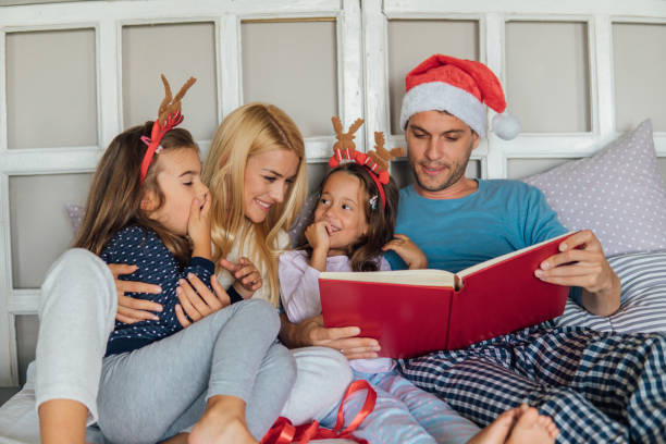istock Young couple reading for the children 1051991212