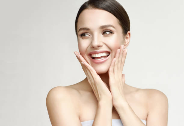 portrait of gorgeous, young laughing woman. joy and happiness. - beauty treatment moisturizer human skin cosmetics imagens e fotografias de stock