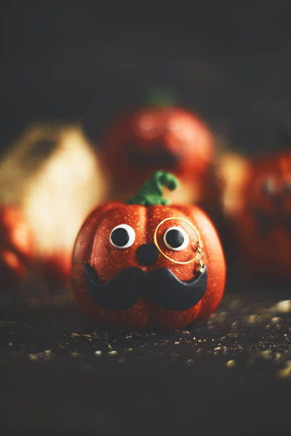 istock Pumpkin character with mustache and monocle 1052006288