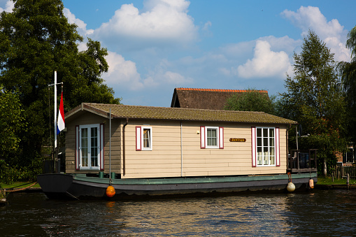 National Park De Alde Feanen, Friesland, The Netherlands - August 21, 2018; House boat on the waterfront for sale, Friesland, The Netherlands