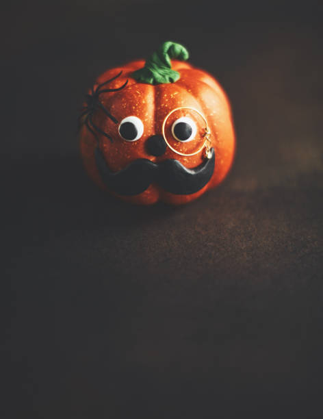 istock Pumpkin gentleman character with mustache and monocle 1052006976