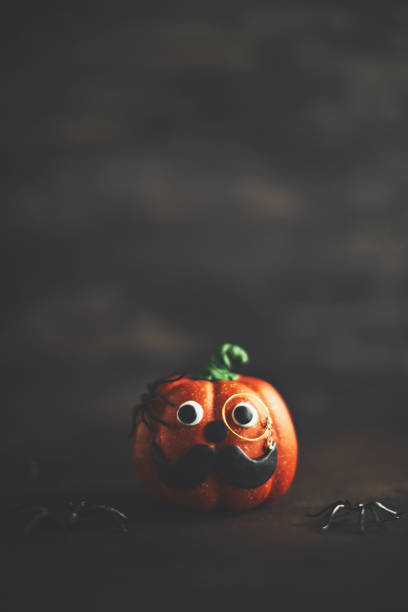 istock Pumpkin gentleman character with mustache and monocle 1052007186