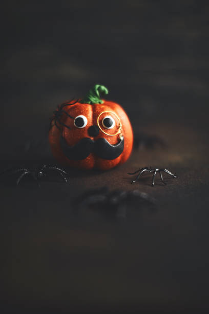 istock Pumpkin gentleman character with mustache and monocle 1052007196