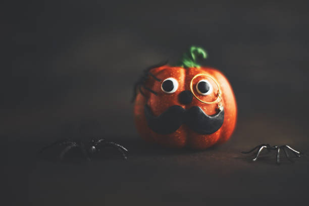 istock Pumpkin gentleman character with mustache and monocle 1052007206