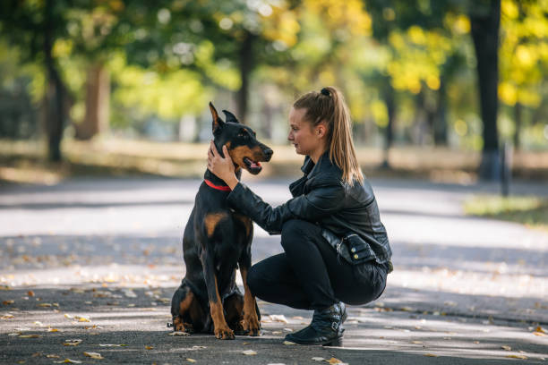 woman-with-beautiful-doberman.jpg