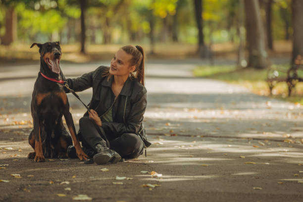 istock Lady with beautiful dog in park 1052030182