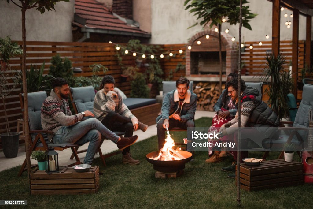Relaxing Evening by the Fire Fire Pit Stock Photo