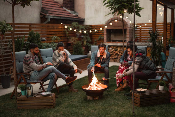 Relaxing Evening by the Fire Relaxing Evening by the Fire fire pit photos stock pictures, royalty-free photos & images