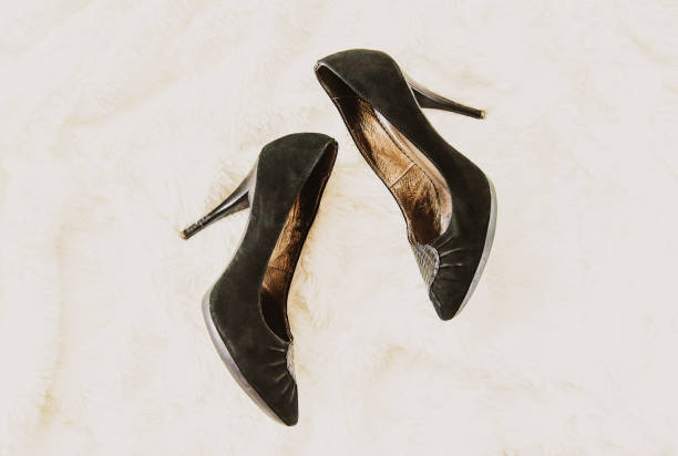istock shoes removed at home after work. legs are tired. Selective focus. 1052043344
