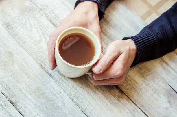 istock Cup drink for Breakfast in the hands of lovers. Selective focus. 1052047470