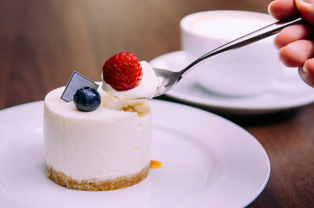istock cheesecake with with raspberry and blueberry on white dish 1052049464