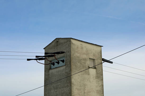 istock transformer house with cables and blue sky 1052073134