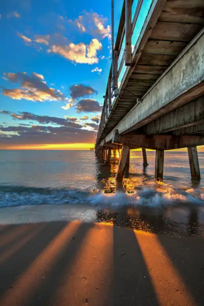 This beautiful image of sky, clouds, light and shadows was captured on the beach at sunrise below Anglin's Pier in Lauderdale-by-the-Sea, Florida.