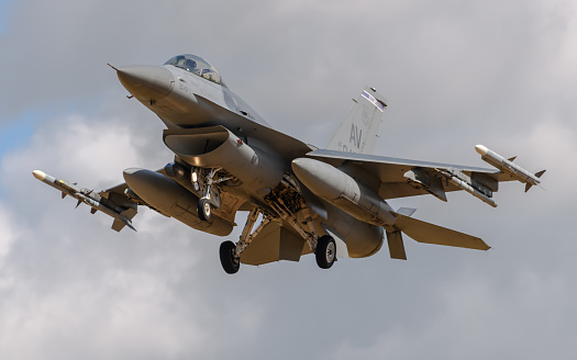 Beja, Portugal: parked General Dynamics F-16 Fighting Falcon of the Portuguese Air Force - Jaguars Squadron, with NATO logo on vertical stabilizer - equipped with external fuel tanks - Beja Airport serves both civil and military aviation.