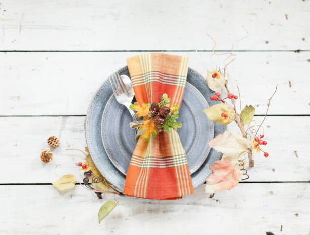 istock Autumn holiday Thanksgiving dining on an old wood table 1052156170
