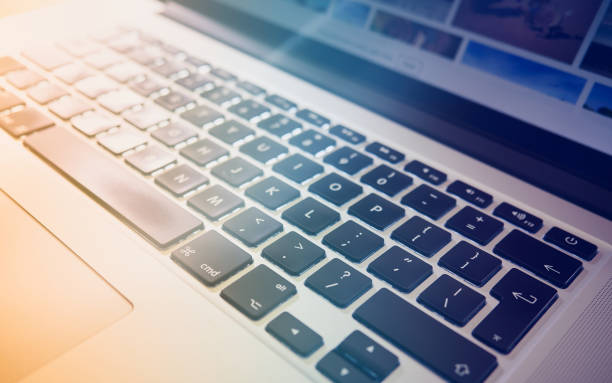 istock Close up, abstract image of a laptop, computer keyboard. 1052167682