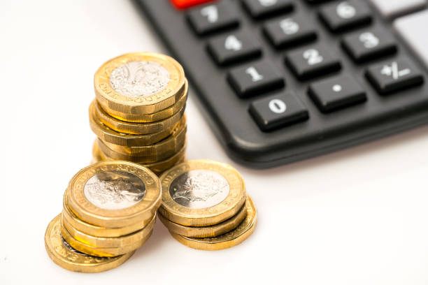 istock New one pound coin in studio, Finance concept 1052168618