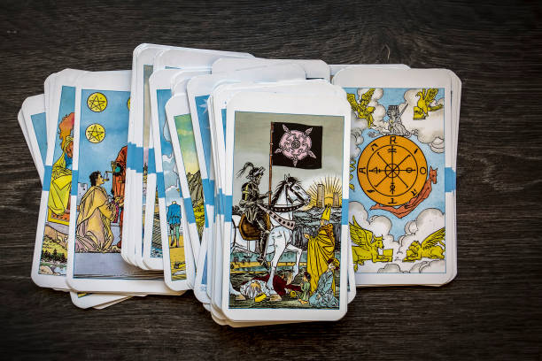 Deck of playing cards standing on white table