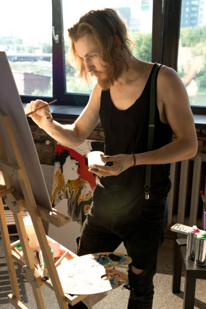 istock Inspired  Man Painting 1052177410