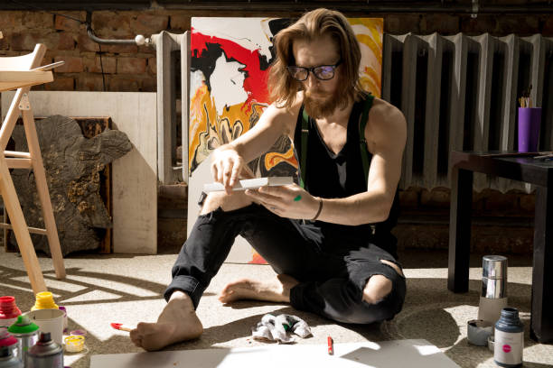istock Contemporary Artist in Sunlit Studio 1052177998