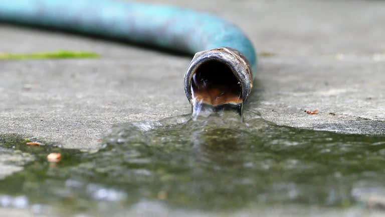 Garden hose close up with water turn on