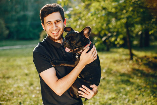 istock Man with french bulldog 1052195334