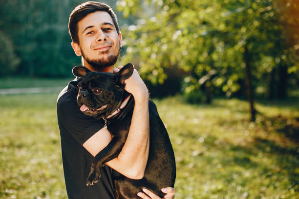 istock Man with french bulldog 1052195580