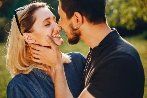 istock happy young couple in the park 1052196420