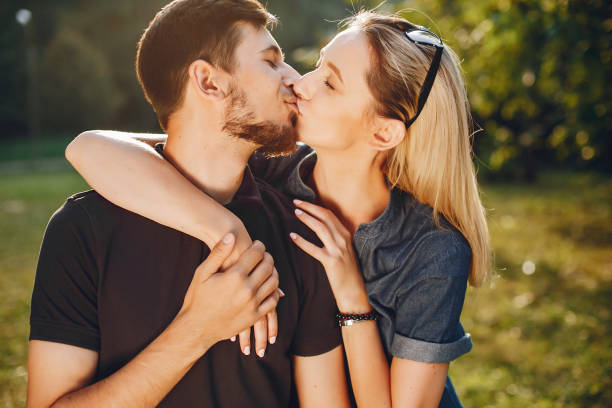 istock happy young couple in the park 1052197554