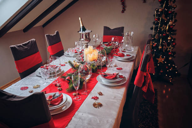 istock Decorated Table for Christmas Dinner with Candles and Christmas Ornaments 1052203210