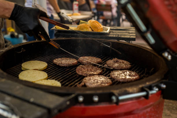 istock Rolls and burgers for burger on a round grill 1052204878