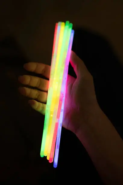 Photo of Glow sticks with hands