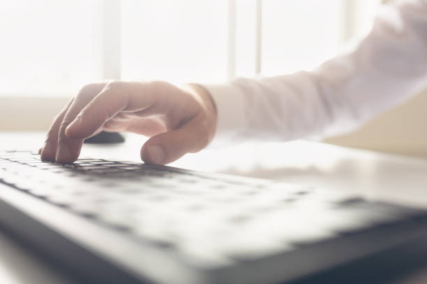 istock Retro image of businessman hand typing on keyboard 1052206852