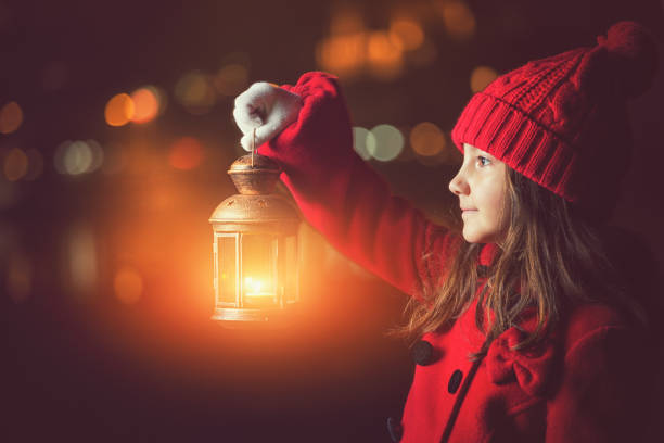 istock Beautiful Little Girl With Lantern Outside 1052207148