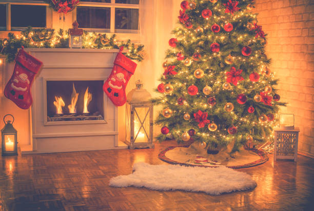 istock Christmas Tree Near Fireplace at Home 1052211226