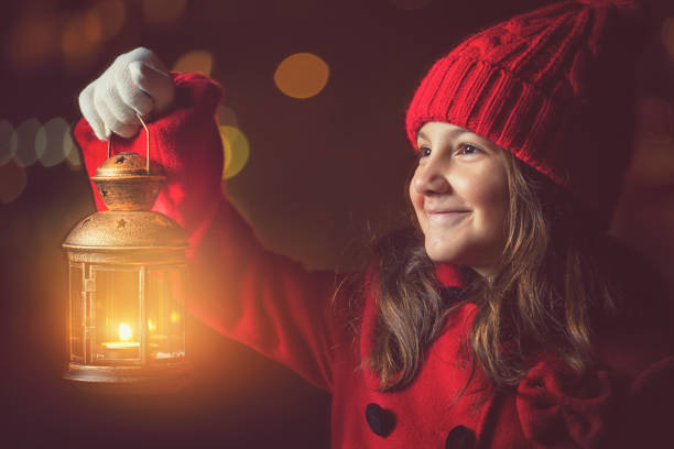 istock Beautiful Little Girl With Lantern Outside 1052211792