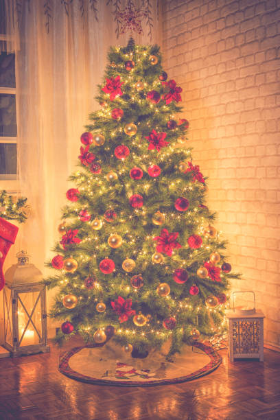 istock Christmas Tree Near Fireplace at Home 1052214404