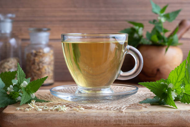 istock A cup of white dead-nettle tea with fresh and dried white dead-nettles 1052237774