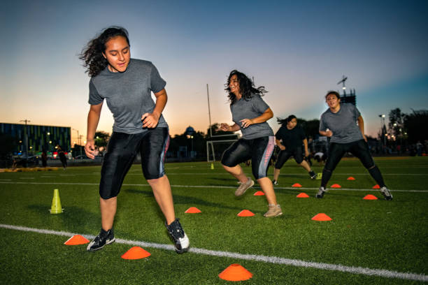 istock Female American Football Team Training 1052276476