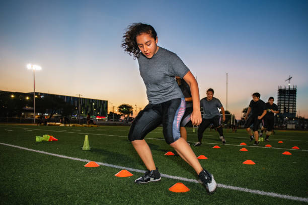istock Female American Football Team Training 1052276534