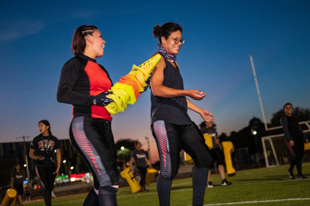 istock Female American Football Team Training 1052276632