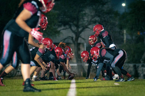 istock Female American Football Team Training 1052277038