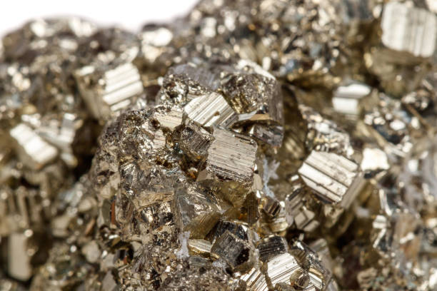 istock Macro mineral stone Pyrite gold on white background 1052317636