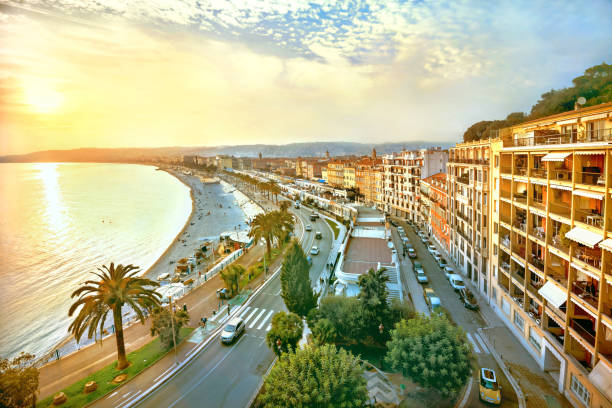 Promenade des Anglais in Nice at sunset. French Riviera, France View of Nice city and Promenade des Anglais at sunset. Cote d’Azur, France nice france stock pictures, royalty-free photos & images