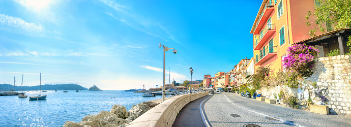 Panoramic view of seaside and street in resort town Villefranche-sur-Mer. Cote d'Azur, France