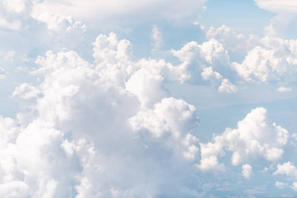 istock Isolated sky cloudscape with fluffy clouds and bright soft sunny sunlight aerial view of Italy from airplane 1052334022