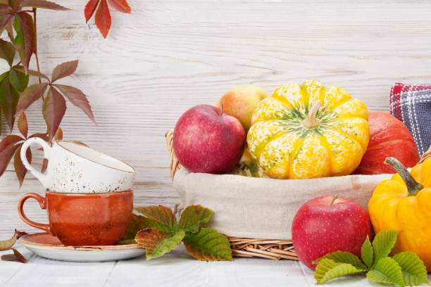 istock Autumn with pumpkins and fruits 1052352158