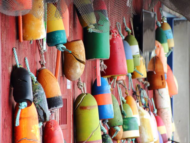 istock Colored Fishing Net Floats on Red Wall 1052354038