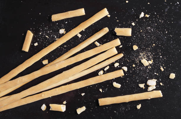 Bread sticks on black